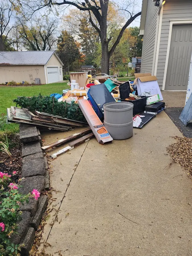 Dumpster being loaded with debris for 30 Yard Dumpster Rental in Mesa